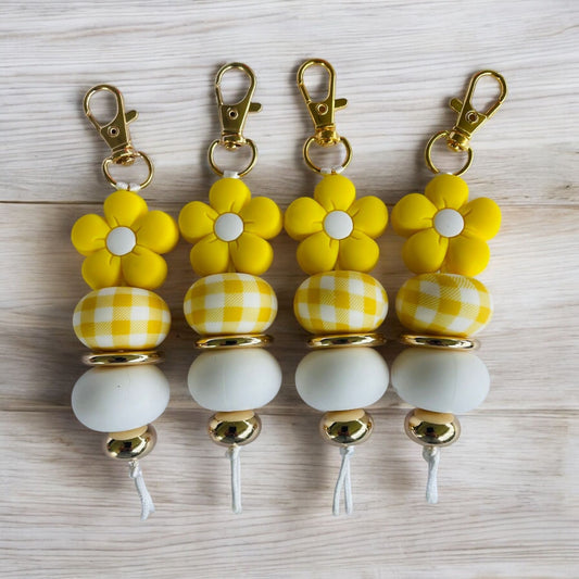 Porte-clés en silicone à motif de fleur jaune
