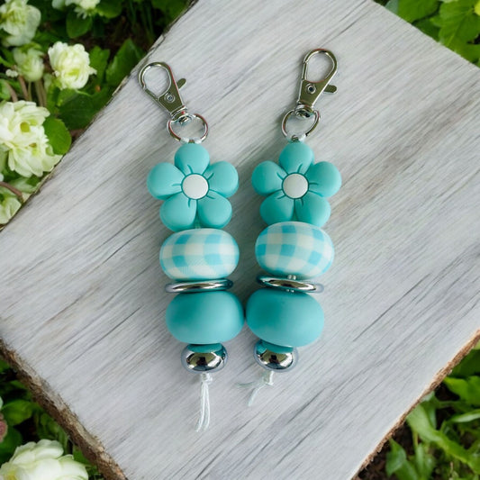 Porte-clés en silicone à motif de fleur sarcelle